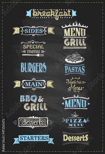 Assorted menu headlines set with symbols, signs and graphic elements on a chalkboard