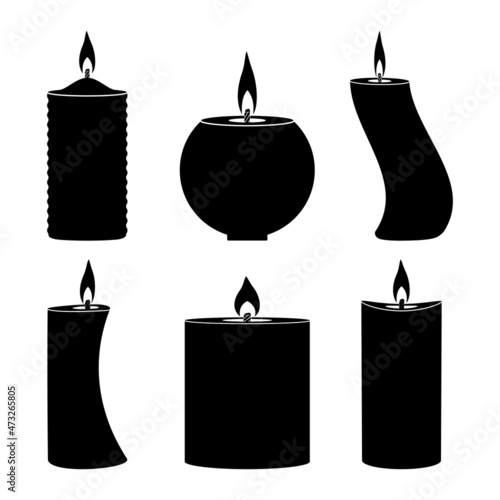 Burning paraffin candles of different shapes in black on a white background.