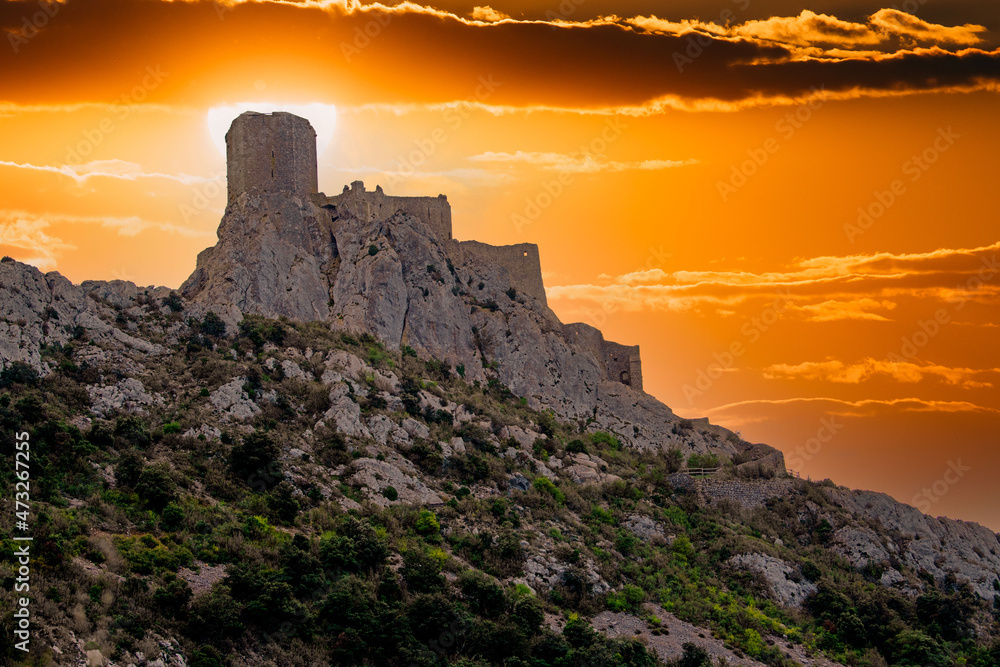 Cathar medieval fortress Queribus from the foot of the mountain in the summer. Languedoc, Occitania, France. - obrazy, fototapety, plakaty 