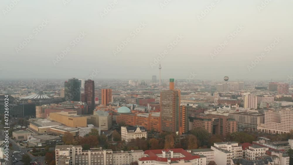 Backwards fly above city. Group of tall modern business or apartment buildings near Potsdamer Platz area. Berlin, Germany Backwards fly above city. Group of tall modern business or apartment buildings near Potsdamer Platz area. Berlin, Germany