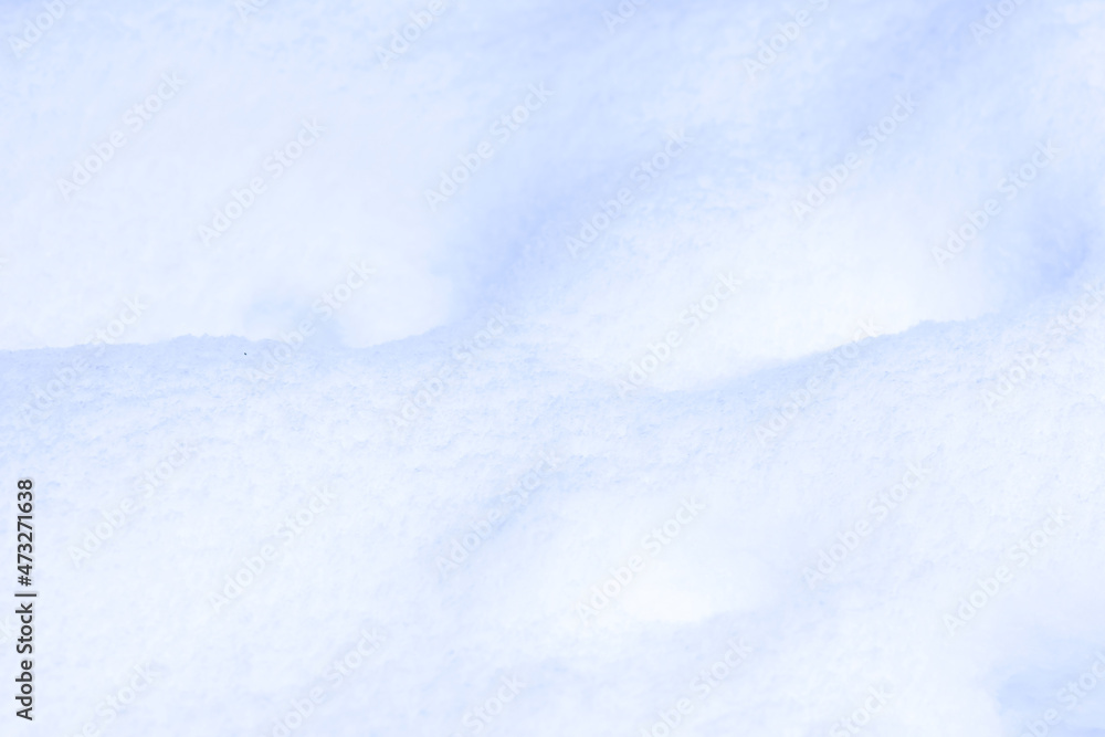 Defocused background of fresh snow, abstract winter view 