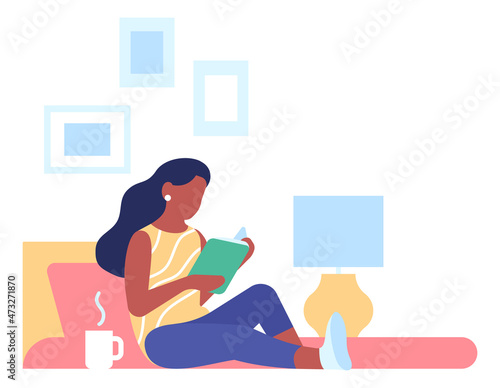 Comfortable reading. Woman holding book. Person relaxing at home