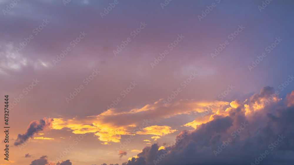 Beautiful cloudy sky with delicate, pastel clouds in the evening
