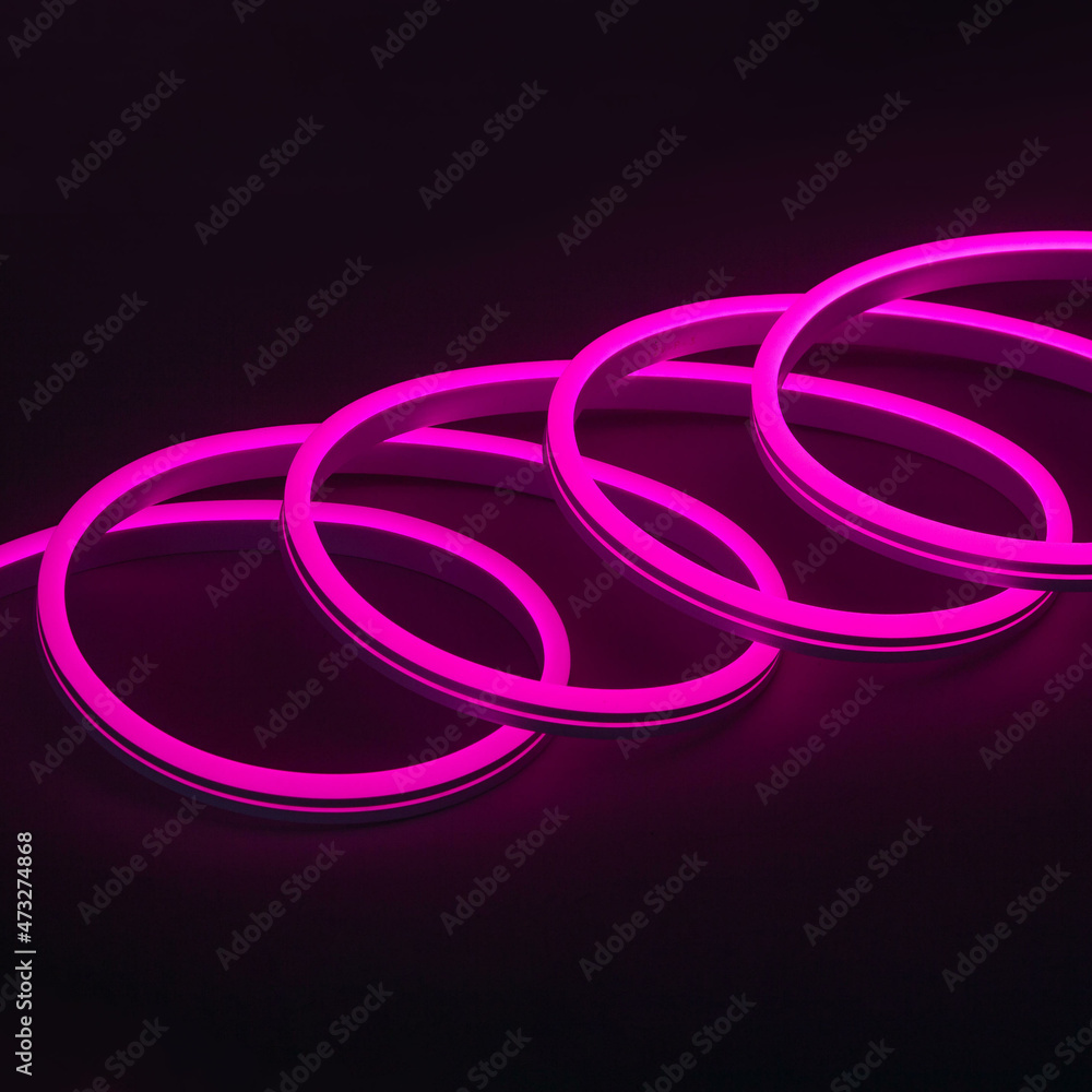 Flexible purple led neon decor christmas light on black background Flexible purple led neon decor christmas light on black background