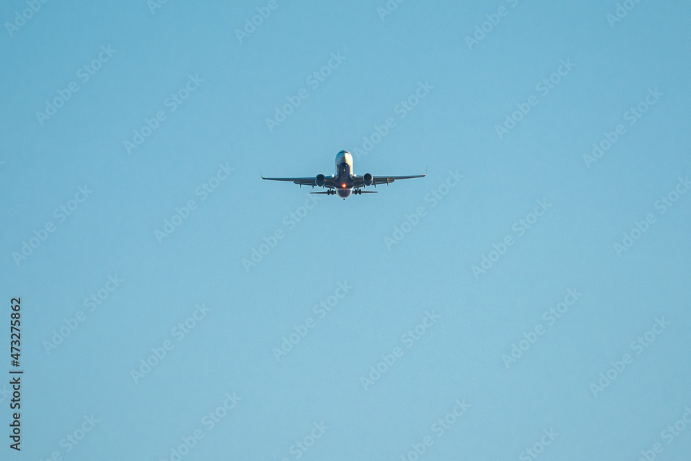 Airplane in the sky with tourists in a tropical country or business travel, business trip Airplane in the sky with tourists in a tropical country or business travel, business trip