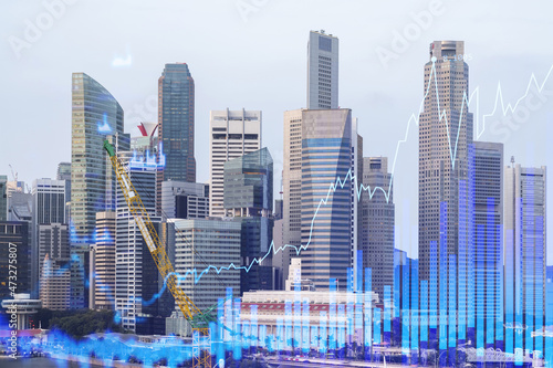 Financial stock chart hologram over panorama city view of Singapore, business center in Asia. The concept of international transactions. Double exposure.