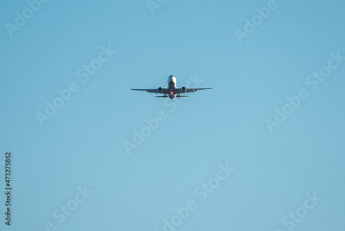 Airplane in the sky with tourists in a tropical country or business travel  business trip
