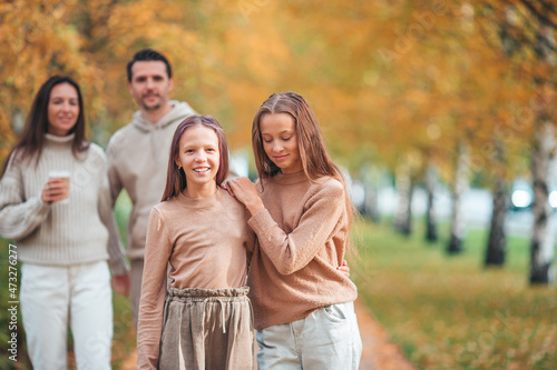 Portrait of happy family of four in autumn © travnikovstudio
