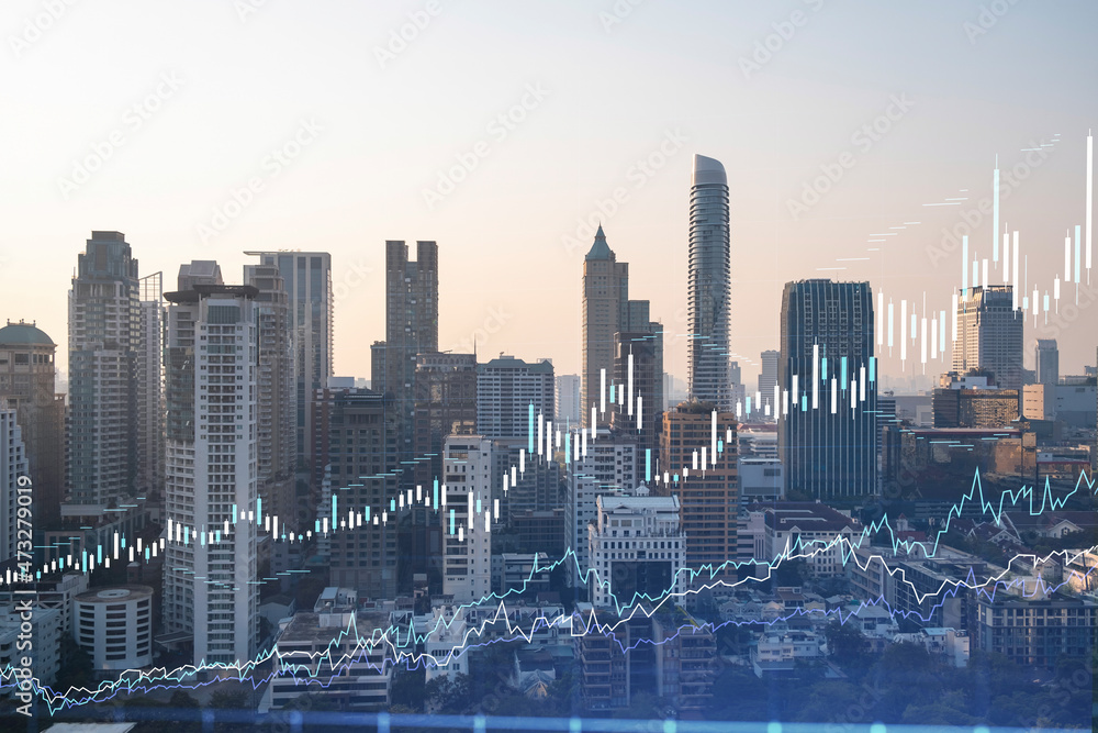 Fototapeta premium Market behavior graph hologram, sunset panoramic city view of Bangkok, popular location to achieve financial degree in Southeast Asia. The concept of financial data analysis. Double exposure.