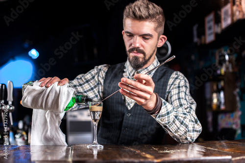 Barman concocts a cocktail at the taproom