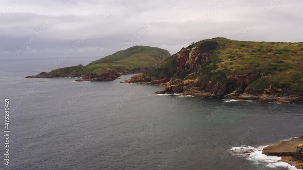 Cliff edge of Little Broughton island on Australian pacific coast in aerial 4k.
Cliff edge of Little Broughton island on Australian pacific coast in aerial 4k.