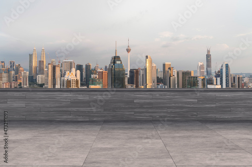 Panoramic Kuala Lumpur skyline view, concrete observatory deck on rooftop, sunset. Asian corporate and residential lifestyle. Financial city downtown, real estate. Product display mockup empty roof