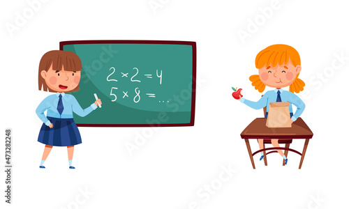 Cute elementary school students in uniform. Girls studying math at lesson cartoon vector illustration