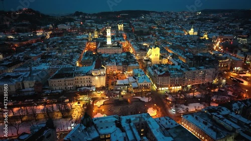 Panorama of the ancient city. City Council, Town Hall, old church Lviv Latin Cathedral. The roofs of old buildings. Aerial, drone view. Winter night. lviv, ukraine photo