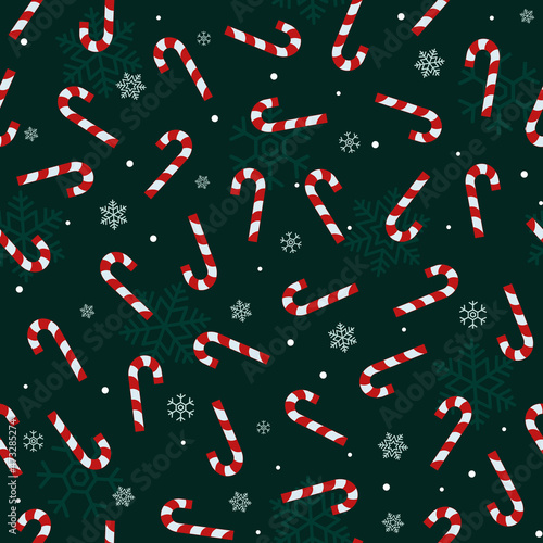 Green Christmas seamless pattern with red candy cane and snowflakes