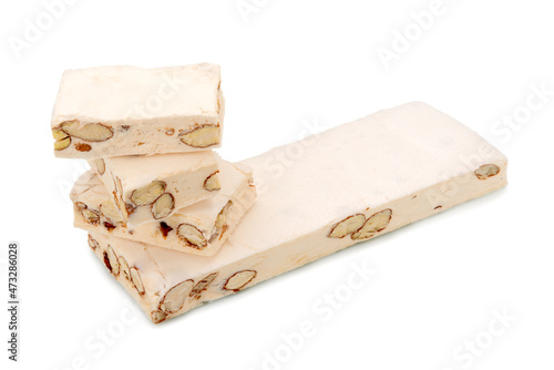 Soft nougat with almonds and hazelnuts isolated on white