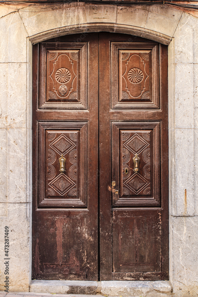 Old and beautiful carved wooden door in Polop