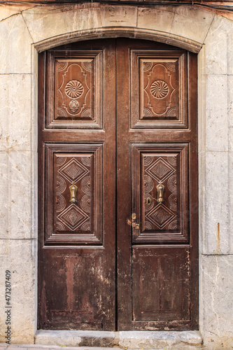 Old and beautiful carved wooden door in Polop