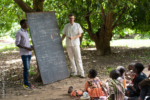 Teaching in a summer school in a remote West African village ; international humanitarian action, volunteering concept