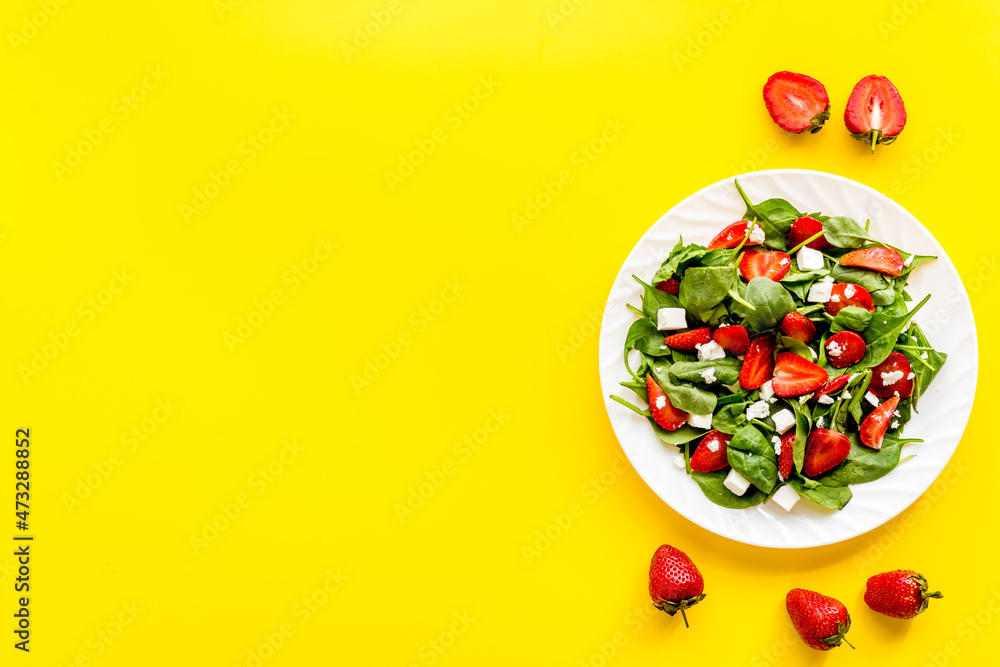 Vegan meal - spinach salad with strawberry and goat cheese Vegan meal - spinach salad with strawberry and goat cheese