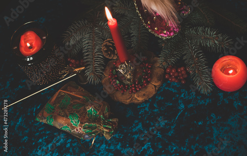 Winter Christmas prediction on a Candle and Tarot cards. Magical esoteric concept. Astrology and wicca rituals photo