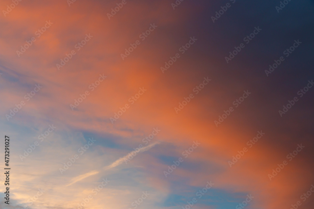 Colorful sunset background with dark and light parts in sky