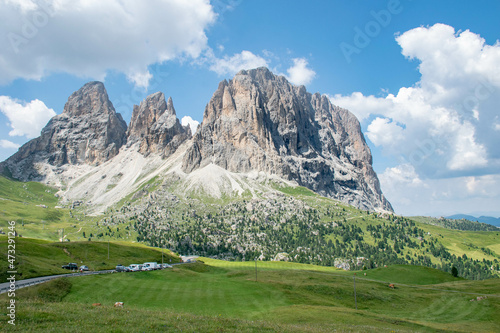 Dolomites, italy, august 2018, green valley next to the Sassolungo mountains in Val Gardena