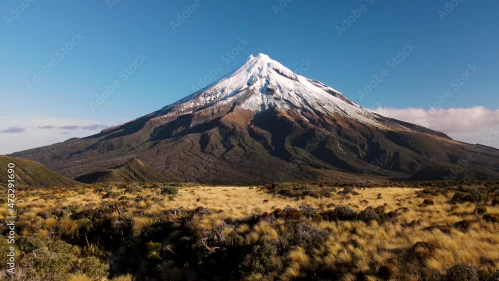 Breathtaking view of perfect cone shaped volcano. Taranaki - aerial. New Zealand pristine natural scenery. Breathtaking view of perfect cone shaped volcano. Taranaki - aerial. New Zealand pristine natural scenery.