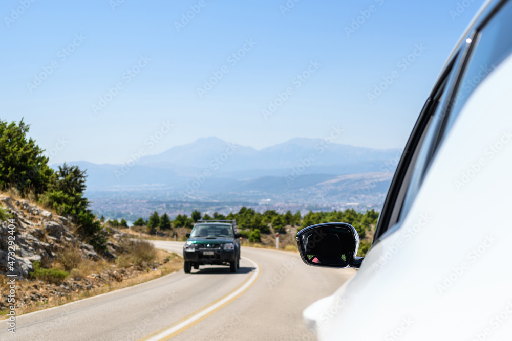 Car on the serpentine mountains road Summer trip vacation. Freedom concept. copy space