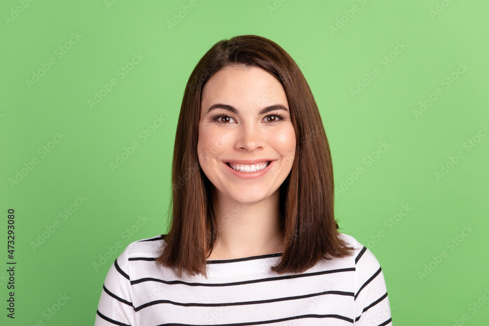 Obraz premium Photo of young cheerful girl toothy smile oral care cavity protection whitening isolated over green color background