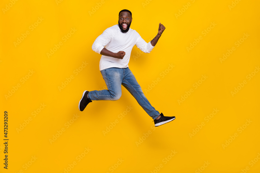 Full length photo of overjoyed person raise fists triumph luck shout yes isolated on yellow color background