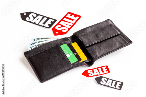 Discount shopping day - sale tag and wallet with banknotes and bank cards