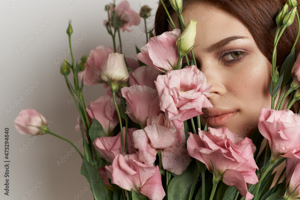 pretty woman in dress posing flowers makeup isolated background