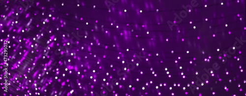 Holiday Purple Background with blurred bokeh lights
