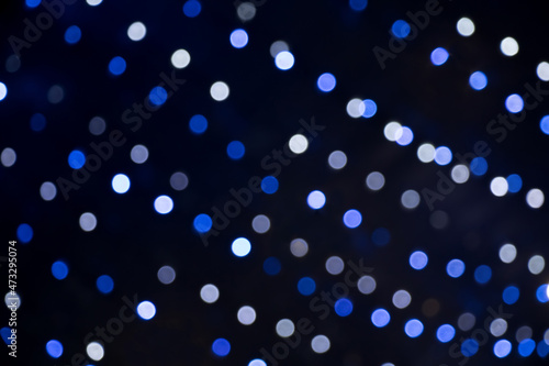 Blue bokeh lights on black background