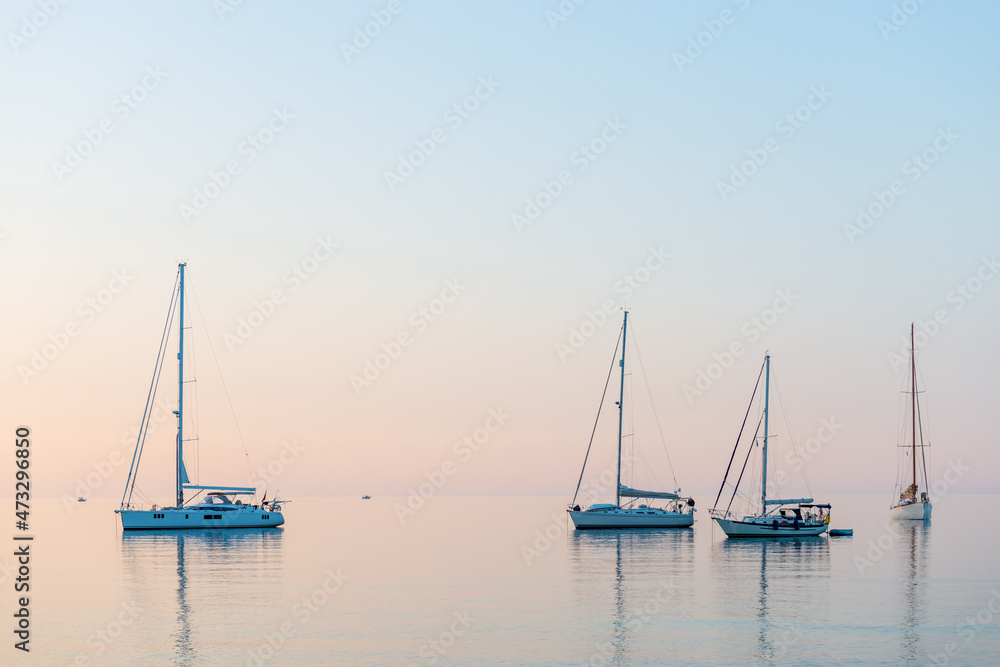 Sailing Yacht from sail regatta on mediterranean sea at sunset