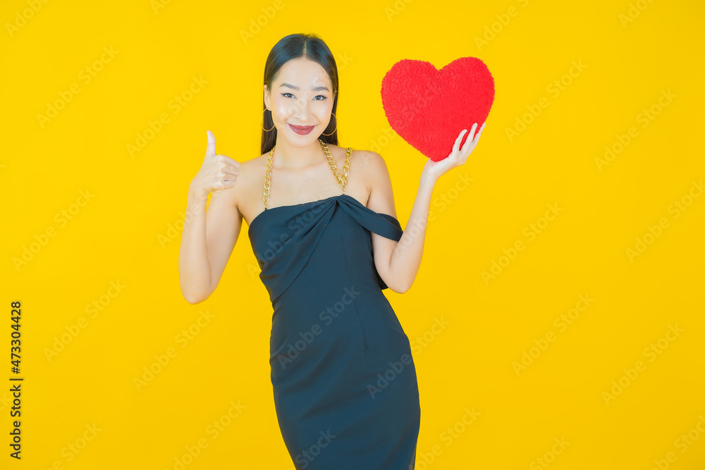 Portrait beautiful young asian woman smile with heart pillow shape Portrait beautiful young asian woman smile with heart pillow shape