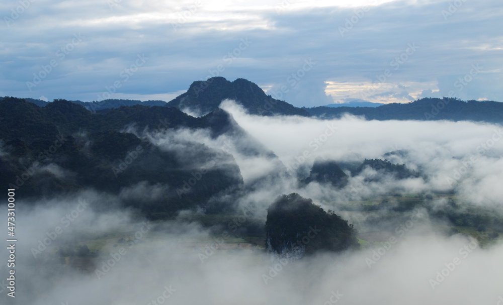 Mountains covered with white mist in winter at Phu Langka, Thailand