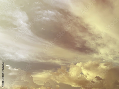 cloud and sky with a pastel yellow-colored background
