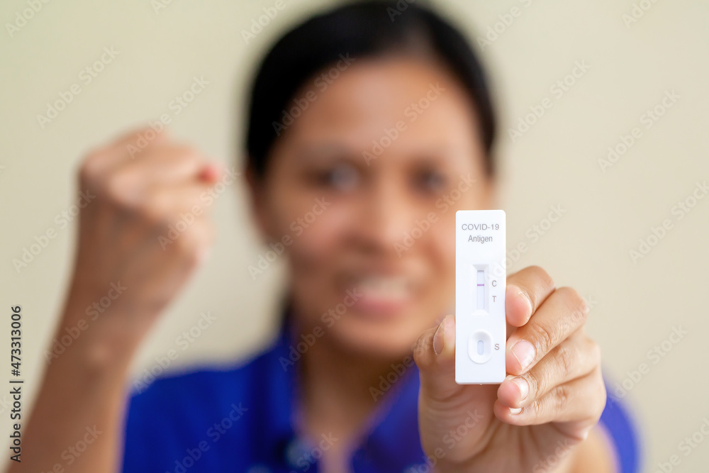 Rapid Covid-19 coronavirus strip test cassette for antibody or sars-cov-2 virus disease in hands epidemic concept background close-up Rapid Covid-19 coronavirus strip test cassette for antibody or sars-cov-2 virus disease in hands epidemic concept background close-up