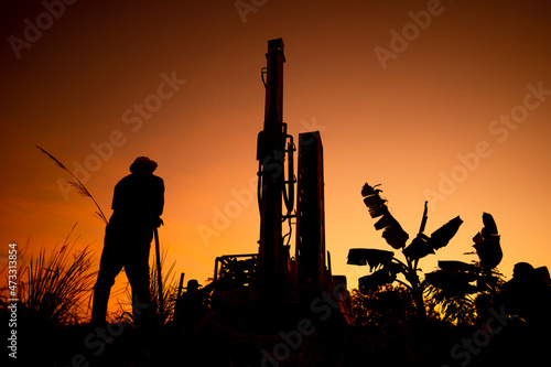 Working drill the artesian on blurred background photo