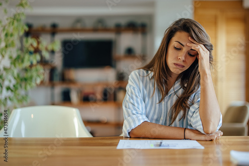 Concentrated caucasian woman, overthinking while working