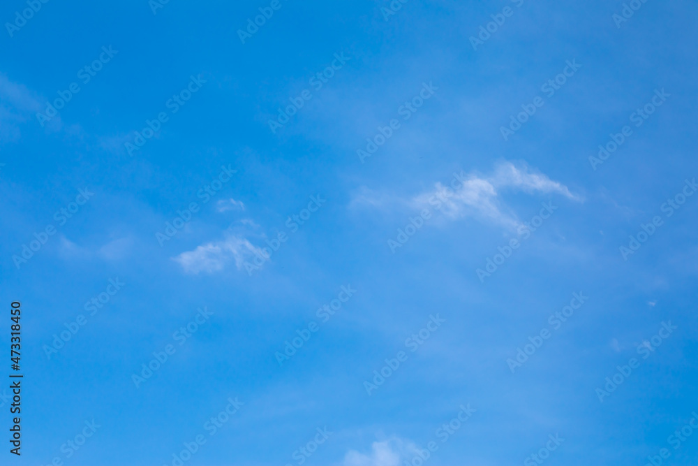 Fototapeta premium Blue sky background with white clouds.