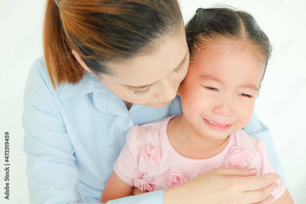 crying little girl being consoled by single mom crying little girl being consoled by single mom