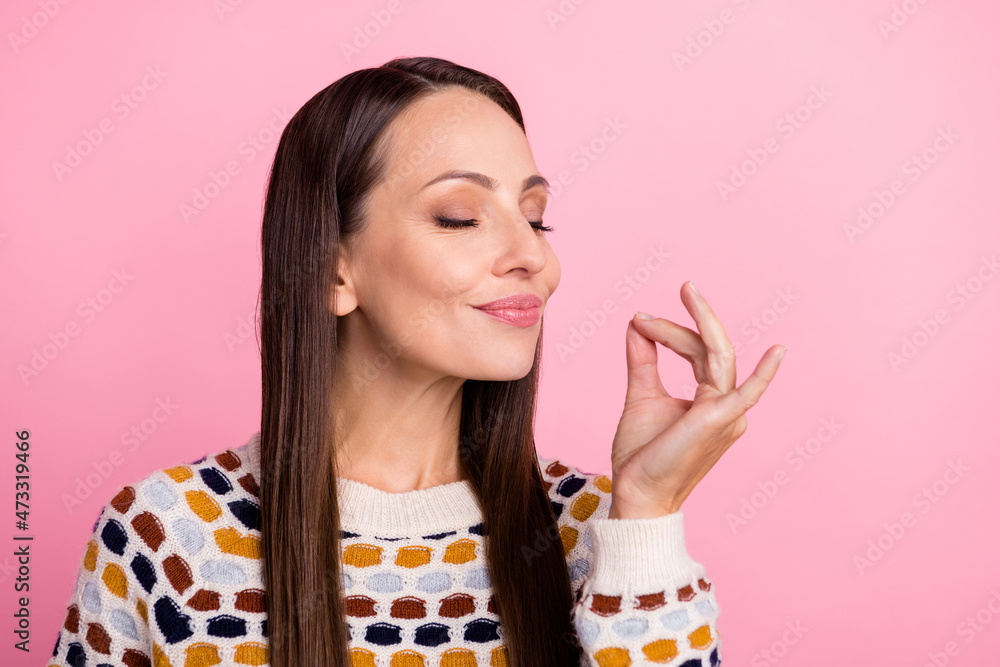 Photo of sweet funny mature lady dressed print pullover trying tasty dish smiling isolated pink color background Photo of sweet funny mature lady dressed print pullover trying tasty dish smiling isolated pink color background