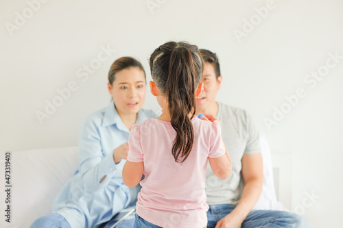 Daughter is be scolding by her parents