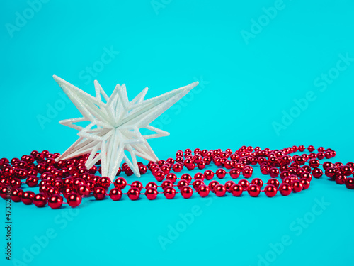 Christmas snowflake with decorations on a blue background (ID: 473321866)