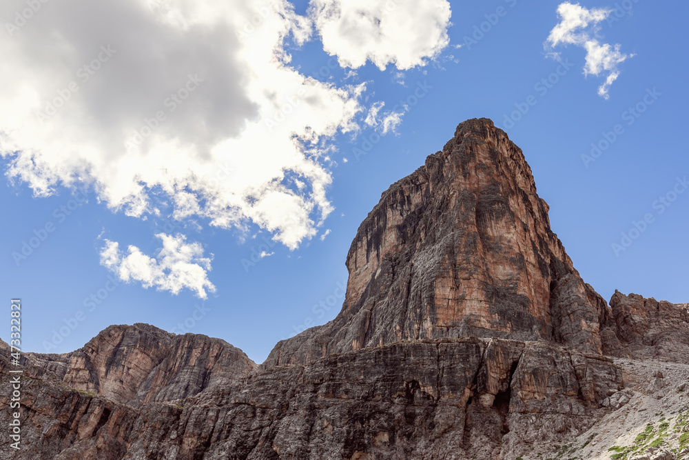 Mountain peak of the Italian Dolomites against the background of clear blue sky