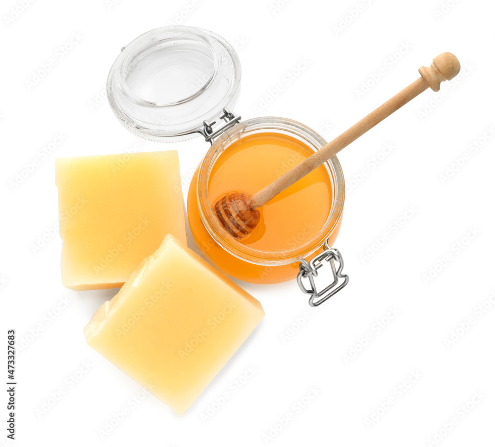 Honey and natural beeswax on white background, top view Honey and natural beeswax on white background, top view