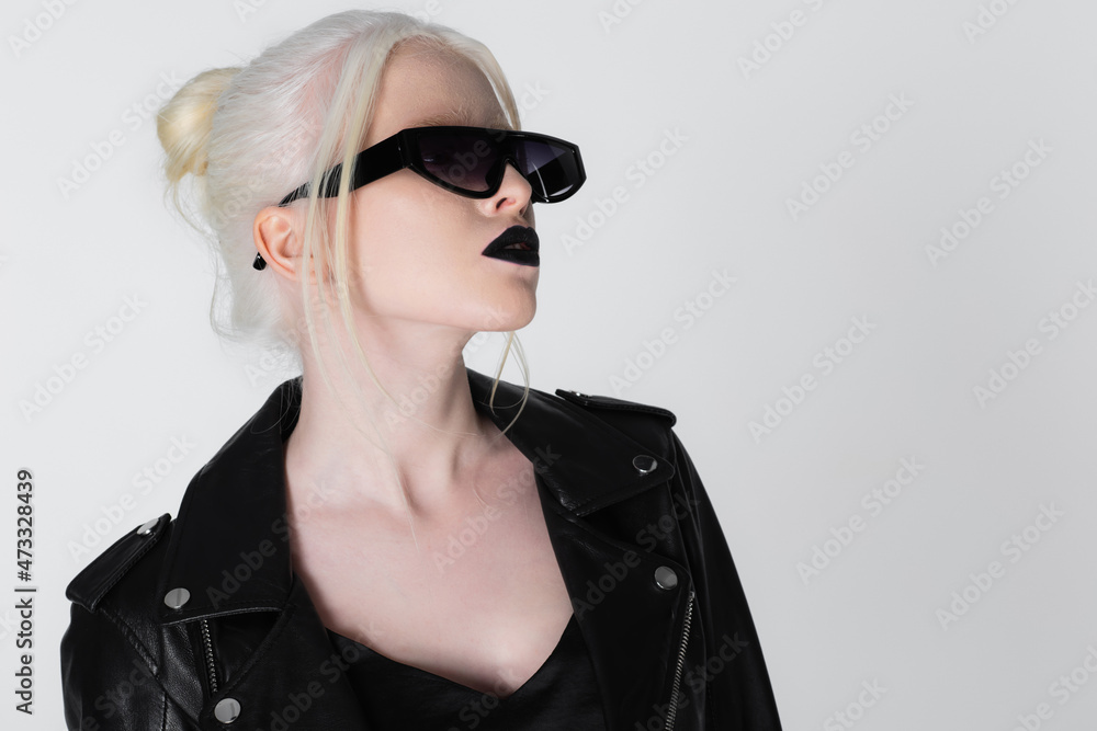 Fashionable albino woman in black sunglasses and leather jacket isolated on white. Fashionable albino woman in black sunglasses and leather jacket isolated on white.